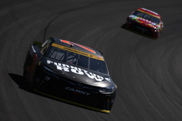 JOLIET, IL - SEPTEMBER 18:  Martin Truex Jr, driver of the #78 Furniture Row/Denver Mattress Toyota, leads Kyle Busch, driver of the #18 Skittles Toyota, during the NASCAR Sprint Cup Series Teenage Mutant Ninja Turtles 400 at Chicagoland Speedway on September 18, 2016 in Joliet, Illinois.  (Photo by Sean Gardner/Getty Images)