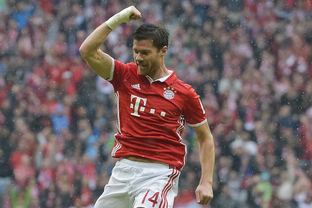 Bayern Munich's Spanish midfielder Xabi Alonso celebrates after scoring during the German first division Bundesliga football match of Bayern Munich vs FC Ingolstadt in Munich, southern Germany, on September 17, 2016. / AFP / GUENTER SCHIFFMANN / RESTRICTIONS: DURING MATCH TIME: DFL RULES TO LIMIT THE ONLINE USAGE TO 15 PICTURES PER MATCH AND FORBID IMAGE SEQUENCES TO SIMULATE VIDEO. == RESTRICTED TO EDITORIAL USE == FOR FURTHER QUERIES PLEASE CONTACT DFL DIRECTLY AT + 49 69 650050
        (Photo credit should read GUENTER SCHIFFMANN/AFP/Getty Images)