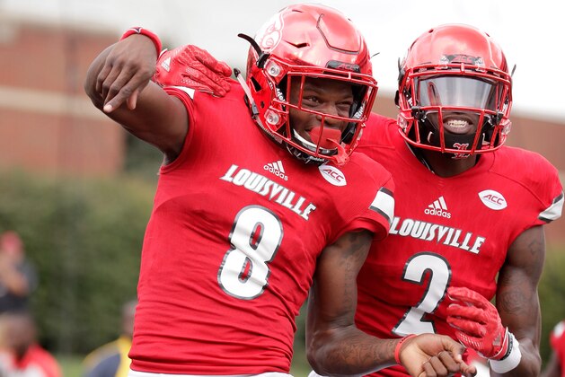 LOUISVILLE, KY - SEPTEMBER 17:  Lamar Jackson #8 of the Louisville Cardinals celebrates with Jamari Staples #2 after he ran for a touchdown against the Florida State Seminoles  at Papa John's Cardinal Stadium on September 17, 2016 in Louisville, Kentucky.  (Photo by Andy Lyons/Getty Images)