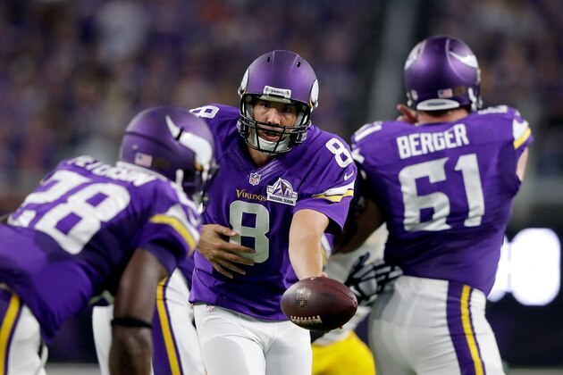 MINNEAPOLIS, MN - SEPTEMBER 18:  Quarterback Sam Bradford #8 of the Minnesota Vikings hands off to running back Adrian Peterson #28 during the game against the Green Bay Packers on September 18, 2016 in Minneapolis, Minnesota.  (Photo by Jamie Squire/Getty Images)