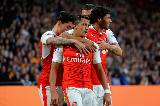 HULL, ENGLAND - SEPTEMBER 17: Alexis Sanchez of Arsenal celebrates scoring their third goal with Hector Bellerin and Mohamed Elneny during the Premier League match between Hull City and Arsenal at KCOM Stadium on September 17, 2016 in Hull, England.  (Photo by Tony Marshall/Getty Images)