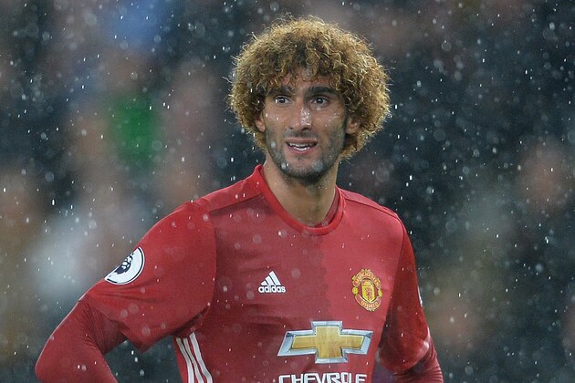 HULL, ENGLAND - AUGUST 27: Marouane Fellaini of Manchester United challenges  during the Premier League match between Manchester United FC and Hull City FC at KC Stadium on August 27, 2016 in Hull, England. (Photo by Mark Runnacles/Getty Images)