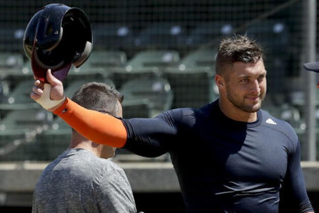 FILE - In this Aug. 30, 2016, file photo, former NFL quarterback Tim Tebow finishes his work out for baseball scouts and the media in Los Angeles. Tebow has signed a minor league contract with the New York Mets. The Mets announced Thursday, Sept. 8, 2016,  that the former quarterback will take part in the Instructional League in Port St. Lucie, Florida.(AP Photo/Chris Carlson, File)