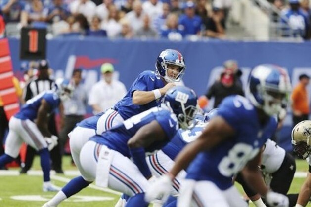 New York Giants quarterback Eli Manning (10) looks at the defense before snapping the ball during the first half of an NFL football game against the New Orleans Saints Sunday, Sept. 18, 2016, in East Rutherford, N.J.  (AP Photo/Seth Wenig)