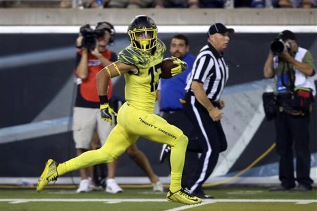 Oregon's Devon Allen is all alone as he sprints to the end zone after pulling down a Dakota Prukop pass against Virginia during the third quarter of an NCAA college football game Saturday, Sept. 10, 2016 in Eugene, Ore. (AP Photo/Chris Pietsch)