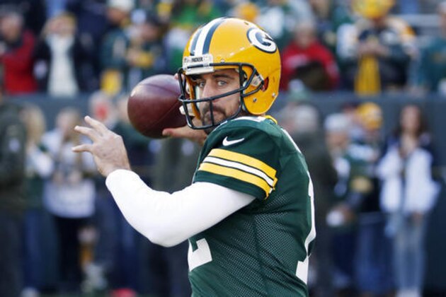 FILE - In this Sunday, Nov. 15, 2015 file photo, Green Bay Packers quarterback Aaron Rodgers warms up before an NFL football game against the Detroit Lions in Green Bay, Wis. Packers coach Mike McCarthy said Monday, July 25, 2016, Rodgers is in great shape as the team starts training camp, and that it's the best shape that he's seen Rodgers in their time together. (AP Photo/Mike Roemer, File)