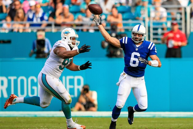MIAMI GARDENS, FL - DECEMBER 27: Charlie Whitehurst #6 of the Indianapolis Colts is pressured by Ndamukong Suh #93 of the Miami Dolphins during the game at Sun Life Stadium on December 27, 2015 in Miami Gardens, Florida.  (Photo by Rob Foldy/Getty Images)
