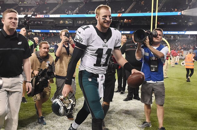 CHICAGO, IL - SEPTEMBER 19:  Carson Wentz #11 of the Philadelphia Eagles walks off the field following a victory over the Chicago Bears at Soldier Field on September 19, 2016 in Chicago, Illinois.  (Photo by Stacy Revere/Getty Images)