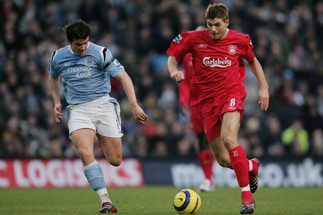 MANCHESTER, ENGLAND - NOVEMBER 26:  Steven Gerrard of Liverpool moves away from Joey Barton of Manchester City during the Barclays Premiership match between Manchester City and Liverpool at The City of Manchester Stadium on  November 26, 2005 in Manchester, England.  (Photo by Clive Brunskill/Getty Images)