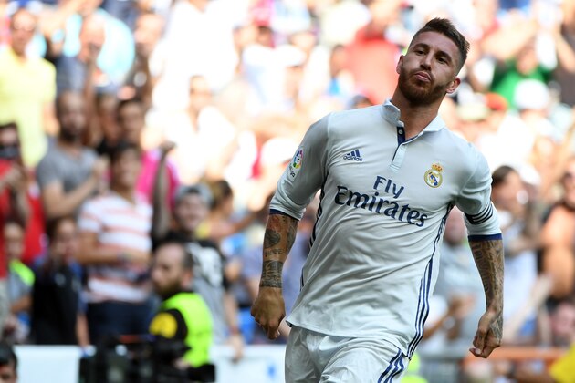 Real Madrid's defender Sergio Ramos celebrates after scoring during the Spanish league football match Real Madrid CF vs CA Osasuna at the Santiago Bernabeu stadium in Madrid on September 10, 2016. / AFP / GERARD JULIEN        (Photo credit should read GERARD JULIEN/AFP/Getty Images)