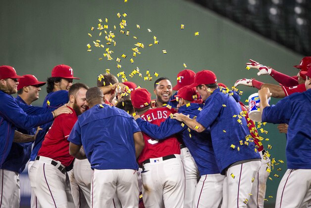 Sep 19, 2016; Arlington, TX, USA; The Texas Rangers celebrate the walk-off win over the Los Angeles Angels at Globe Life Park in Arlington. The Rangers defeat the Angels 3-2. Mandatory Credit: Jerome Miron-USA TODAY Sports