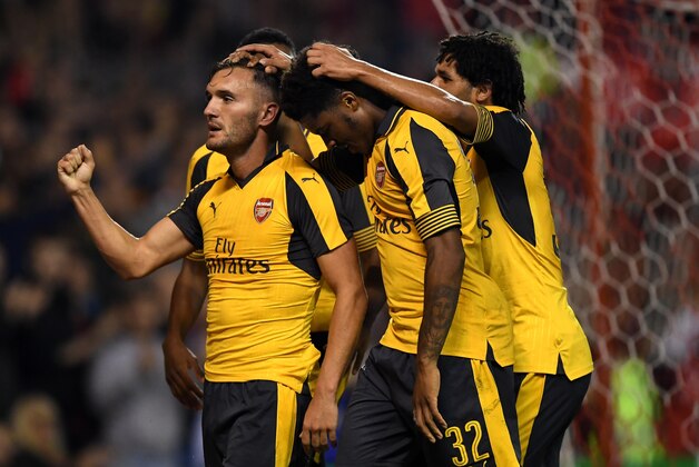 NOTTINGHAM, ENGLAND - SEPTEMBER 20:  Lucas Perez (L) of Arsenal celebrates scoring his team's third goal during the EFL Cup Third Round match between Nottingham Forest and Arsenal at City Ground on September 20, 2016 in Nottingham, England.  (Photo by Shaun Botterill/Getty Images)
