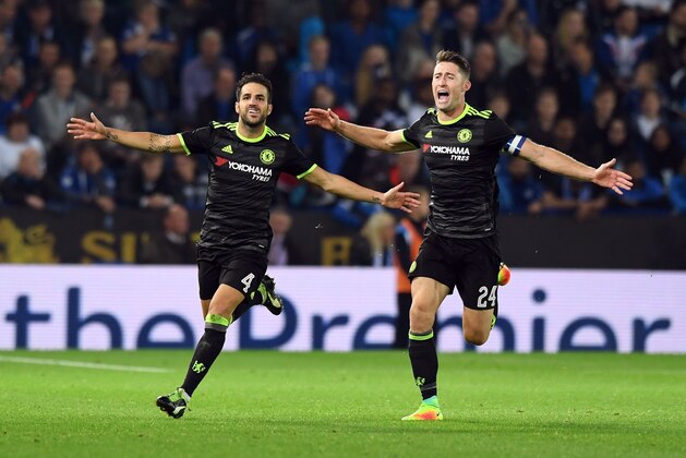 Chelsea's Spanish midfielder Cesc Fabregas (L) celebrates scoring their fourth goal with teammate Gary Cahill (R) during extra-time in the English League Cup third round football match between Leicester City and Chelsea at King Power Stadium in Leicester, central England on September 20, 2016. / AFP / ANTHONY DEVLIN / RESTRICTED TO EDITORIAL USE. No use with unauthorized audio, video, data, fixture lists, club/league logos or 'live' services. Online in-match use limited to 75 images, no video emulation. No use in betting, games or single club/league/player publications.  /         (Photo credit should read ANTHONY DEVLIN/AFP/Getty Images)