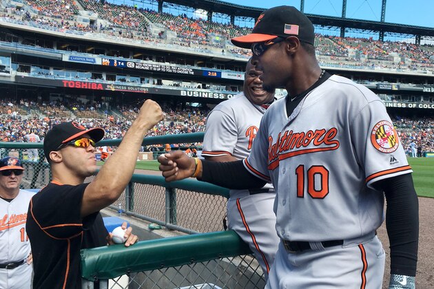 DETROIT, MI - SEPTEMBER 11:  Adam Jones #10 of the Baltimore Orioles is congratulated by Ubaldo Jimenez #31 of the Baltimore Orioles after making a catch on a fly ball hit by Cameron Maybin of the Detroit Tigers during the third inning as first base coach Wayne Kirby #21 of the Baltimore Orioles looks on at Comerica Park on September 11, 2016 in Detroit, Michigan. (Photo by Duane Burleson/Getty Images)