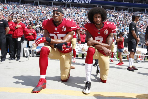 CHARLOTTE, NC - SEPTEMBER 18: Eric Reid #35 and Colin Kaepernick #7 of the San Francisco 49ers kneel on the sideline, during the anthem, prior to the game against the Carolina Panthers at Bank of America Stadium on September 18, 2016 in Charlotte, North Carolina. The Panthers defeated the 49ers 46-27. (Photo by Michael Zagaris/San Francisco 49ers/Getty Images)