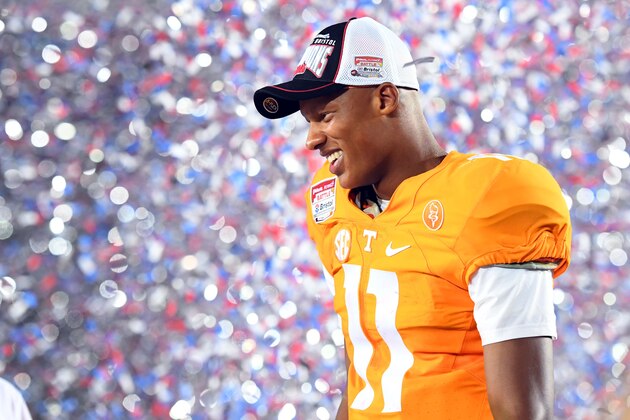 Sep 10, 2016; Bristol, TN, USA; Tennessee Volunteers quarterback Joshua Dobbs (11) celebrates after a win against the Virginia Tech Hokies at Bristol Motor Speedway. Tennessee won 45-24. Mandatory Credit: Christopher Hanewinckel-USA TODAY Sports