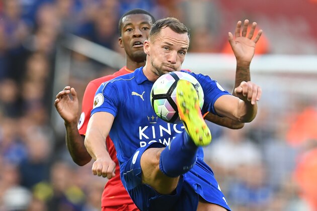 Leicester City's English midfielder Danny Drinkwater (R) vies with Liverpool's Dutch midfielder Georginio Wijnaldum during the English Premier League football match between Liverpool and Leicester City at Anfield in Liverpool, north west England on September 10, 2016. / AFP / Paul ELLIS / RESTRICTED TO EDITORIAL USE. No use with unauthorized audio, video, data, fixture lists, club/league logos or 'live' services. Online in-match use limited to 75 images, no video emulation. No use in betting, games or single club/league/player publications.  /         (Photo credit should read PAUL ELLIS/AFP/Getty Images)