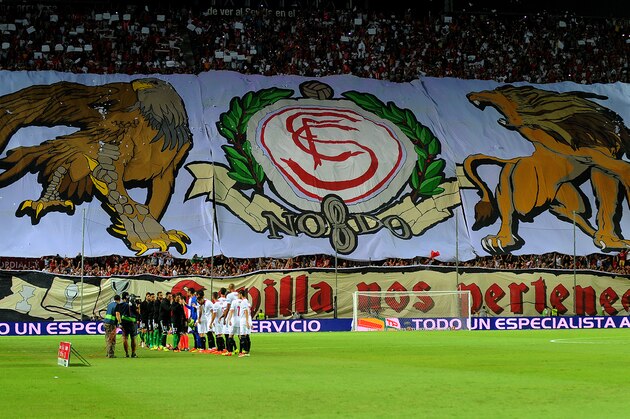 Sevilla supporters display a giant banner before the Spanish league football match Sevilla FC vs Real Betis at the Ramon Sanchez Pizjuan stadium in Sevilla on September 20, 2016.
Sevilla won 1-0. / AFP / CRISTINA QUICLER        (Photo credit should read CRISTINA QUICLER/AFP/Getty Images)