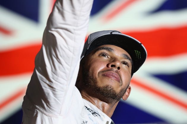 SINGAPORE - SEPTEMBER 18:  Lewis Hamilton of Great Britain and Mercedes GP celebrates on the podium during the Formula One Grand Prix of Singapore at Marina Bay Street Circuit on September 18, 2016 in Singapore.  (Photo by Clive Mason/Getty Images)