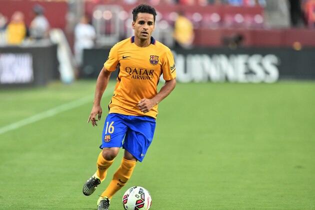Barcelona's Douglas looks to pass the ball during an International Champions Cup football match against Chelsea in Landover, Maryland, on July 28, 2015.    AFP PHOTO/NICHOLAS KAMM        (Photo credit should read NICHOLAS KAMM/AFP/Getty Images)