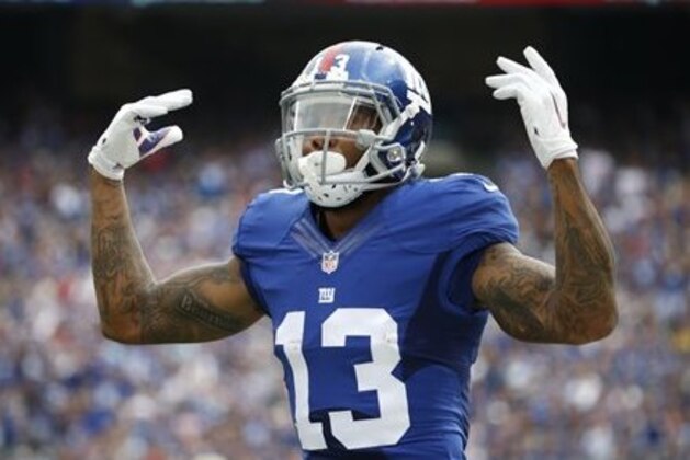 New York Giants wide receiver Odell Beckham (13) reacts after a play during the first half of an NFL football game against the New Orleans Saints Sunday, Sept. 18, 2016, in East Rutherford, N.J.  (AP Photo/Kathy Willens)