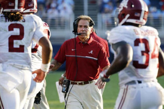 Alabama head coach Nick Saban, center, calls to his players following a touchdown against Mississippi in the second half of an NCAA college football game, Saturday, Sept. 17, 2016 in Oxford, Miss. (AP Photo/Rogelio V. Solis)