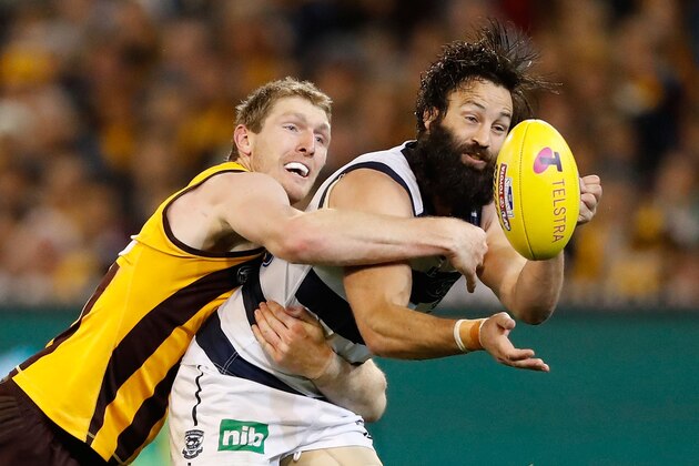 MELBOURNE, AUSTRALIA - SEPTEMBER 09: Jimmy Bartel of the Cats is tackled by Ben McEvoy of the Hawks during the 2016 AFL Second Qualifying Final match between the Geelong Cats and the Hawthorn Hawks at the Melbourne Cricket Ground on September 09, 2016 in Melbourne, Australia. (Photo by Adam Trafford/AFL Media/Getty Images)