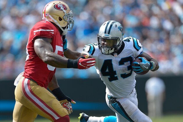 CHARLOTTE, NC - SEPTEMBER 18:  Fozzy Whittaker #43 of the Carolina Panthers runs against NaVorro Bowman #53 of the San Francisco 49ers during the game at Bank of America Stadium on September 18, 2016 in Charlotte, North Carolina.  (Photo by Grant Halverson/Getty Images)