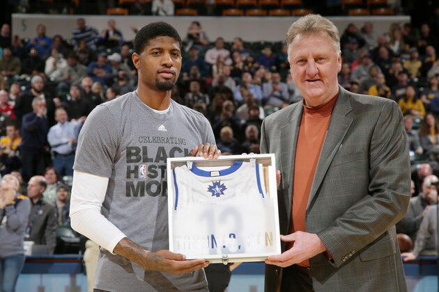 INDIANAPOLIS, IN - FEBRUARY 10: Paul George #13 of the Indiana Pacers is handed his All Star Jersey from former NBA player Larry Bird before the game against the Charlotte Hornets on February 10, 2016 at Bankers Life Fieldhouse in Indianapolis, Indiana. NOTE TO USER: User expressly acknowledges and agrees that, by downloading and or using this Photograph, user is consenting to the terms and conditions of the Getty Images License Agreement. Mandatory Copyright Notice: Copyright 2016 NBAE (Photo by Ron Hoskins/NBAE via Getty Images)