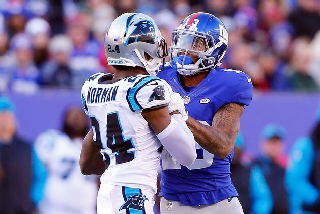 EAST RUTHERFORD, NJ - DECEMBER 20:  (NEW YORK DAILIES OUT)    Josh Norman #24 of the Carolina Panthers and Odell Beckham #13 of the New York Giants get involved after a play during the first half  on December 20, 2015 at MetLife Stadium in East Rutherford, New Jersey. The Panthers defeated the Giants 38-35.  (Photo by Jim McIsaac/Getty Images)