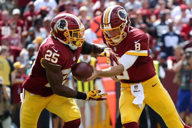 Sep 18, 2016; Landover, MD, USA; Washington Redskins quarterback Kirk Cousins (8) hands the ball off to Redskins running back Chris Thompson (25) against the Dallas Cowboys at FedEx Field. Mandatory Credit: Geoff Burke-USA TODAY Sports