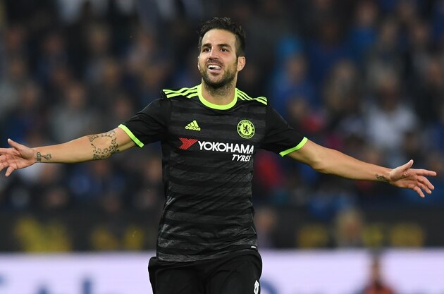 Chelsea's Spanish midfielder Cesc Fabregas celebrates scoring their fourth goal during extra-time in the English League Cup third round football match between Leicester City and Chelsea at King Power Stadium in Leicester, central England on September 20, 2016. / AFP / Anthony DEVLIN / RESTRICTED TO EDITORIAL USE. No use with unauthorized audio, video, data, fixture lists, club/league logos or 'live' services. Online in-match use limited to 75 images, no video emulation. No use in betting, games or single club/league/player publications.  /         (Photo credit should read ANTHONY DEVLIN/AFP/Getty Images)