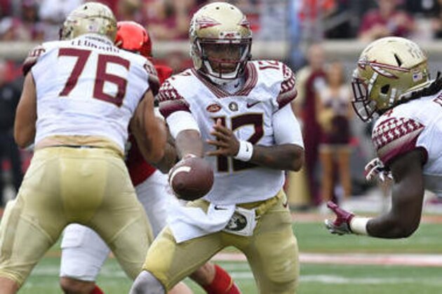 Florida State's Deondre Francois (12) hands the ball off to Dalvin Cook (4) during the first quarter of an NCAA college football game against Louisville, Saturday, Sep. 17, 2016 in Louisville Ky. (AP Photo/Timothy D. Easley)