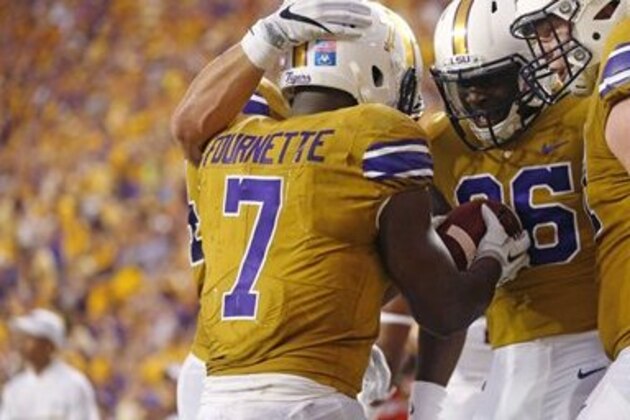 LSU running back Leonard Fournette (7) celebrates his touchdown with wide receiver Jazz Ferguson (86) and center Ethan Pocic (77) in the first half of an NCAA college football game in Baton Rouge, La., Saturday, Sept. 17, 2016. (AP Photo/Gerald Herbert)