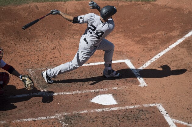 BOSTON, MA - SEPTEMBER 17:  Gary Sanchez #24 of the New York Yankees hits a three-run home run against the Boston Red Sox in the third inning on September 17, 2016  at Fenway Park in Boston, Massachusetts. (Photo by Michael Ivins/Boston Red Sox/Getty Images)