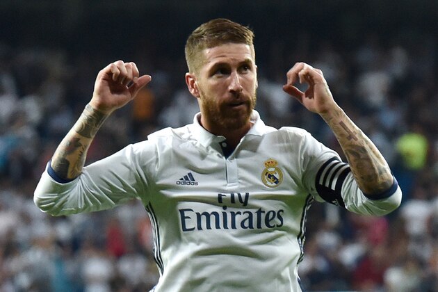 Real Madrid's defender Sergio Ramos celebrates a goal during the Spanish league football match Real Madrid CF vs Villarreal CF at the Santiago Bernabeu stadium in Madrid on September 21, 2016. / AFP / GERARD JULIEN        (Photo credit should read GERARD JULIEN/AFP/Getty Images)