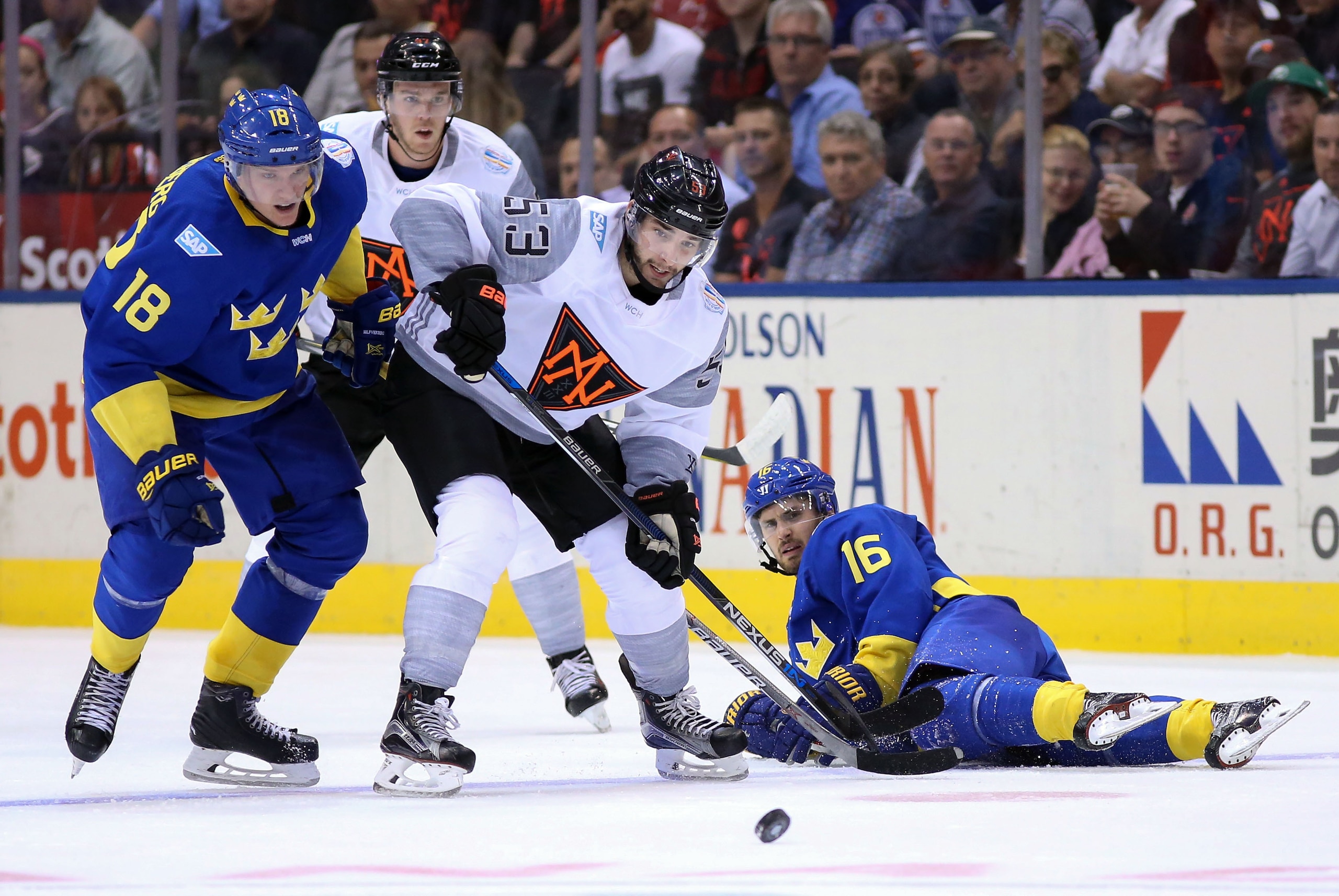Sep 21, 2016; Toronto, Ontario, Canada; Team Sweden right winger Jakob Silfverberg (18) and Team North America defenceman Shayne Gostisbehere (53) battle for the puck in the second period during preliminary round play in the 2016 World Cup of Hockey at Air Canada Centre. Mandatory Credit: Kevin Sousa-USA TODAY Sports