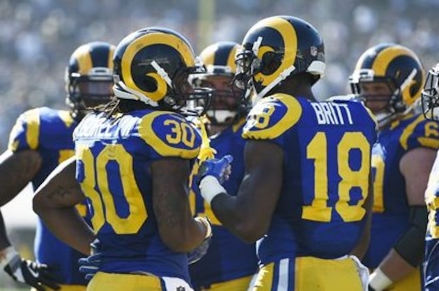 Los Angeles Rams running back Todd Gurley (30) talks with wide receiver Kenny Britt (18) during the second half of an NFL football game against the Seattle Seahawks at the Los Angeles Memorial Coliseum, Sunday, Sept. 18, 2016, in Los Angeles. (AP Photo/Kelvin Kuo)