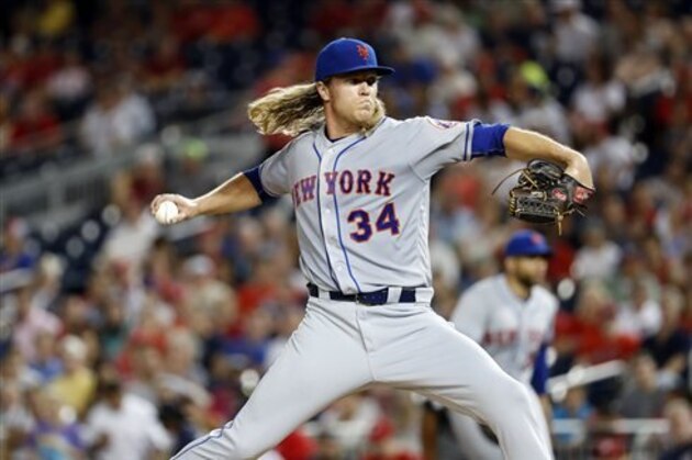 New York Mets starting pitcher Noah Syndergaard throws during a baseball game against the Washington Nationals at Nationals Park, Tuesday, Sept. 13, 2016, in Washington. (AP Photo/Alex Brandon)