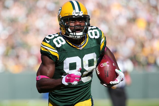 GREEN BAY, WI - OCTOBER 11:  Ty Montgomery #88 of the Green Bay Packers runs the football back 31 yards for a touchdown against the St. Louis Rams in the first quarter at Lambeau Field on October 11, 2015 in Green Bay, Wisconsin.  (Photo by Jonathan Daniel/Getty Images)