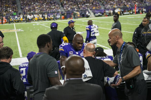 MINNEAPOLIS, MN - SEPTEMBER 18: Adrian Peterson #28 of the Minnesota Vikings has his knee tended to on the sidelines in the third quarter of their game against the Green Bay Packers on September 18, 2016 at US Bank Stadium in Minneapolis, Minnesota. (Photo by Stephen Maturen/Getty Images)