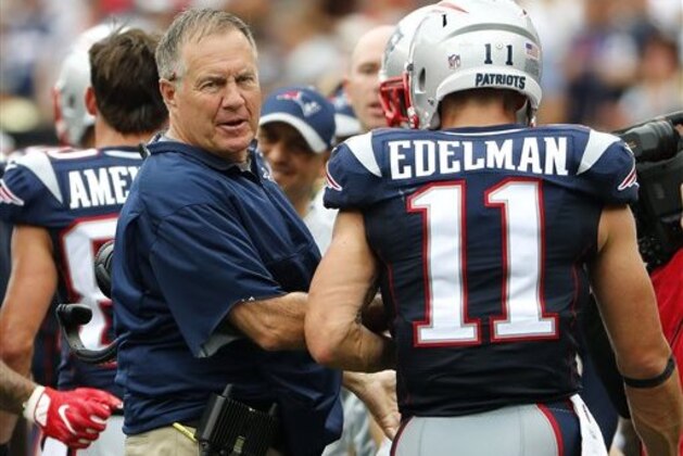 New England Patriots head coach Bill Belichick greets wide receiver Julian Edelman during a NFL football game against the Miami Dolphins at Gillette Stadium in Foxborough, Mass. Sunday, Sept. 18, 2016. (Winslow Townson/AP Images for Panini)