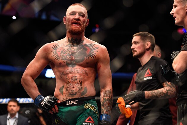 LAS VEGAS, NV - AUGUST 20:  Conor McGregor of Ireland awaits the judges decision with his team after finishing five rounds against Nate Diaz in their welterweight bout during the UFC 202 event at T-Mobile Arena on August 20, 2016 in Las Vegas, Nevada. (Photo by Jeff Bottari/Zuffa LLC/Zuffa LLC via Getty Images)