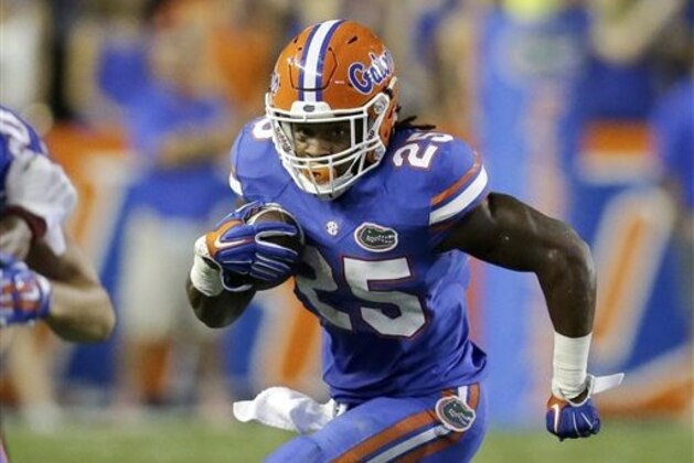 Florida running back Jordan Scarlett (25) gains yardage against New Mexico State during the second half of an NCAA college football game, Saturday, Sept. 5, 2015, in Gainesville, Fla. Florida won 61-13. (AP Photo/John Raoux)