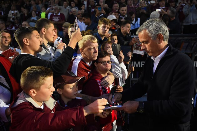 NORTHAMPTON, ENGLAND - SEPTEMBER 21:  Jose Mourinho manager of Manchester United signs autographs prior to the EFL Cup Third Round match between Northampton Town and Manchester United at Sixfields on September 21, 2016 in Northampton, England.  (Photo by Laurence Griffiths/Getty Images)