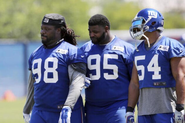 New York Giants defensive tackles Damon Harrison (98) and Johnathan Hankins (95) walk on the field with defensive end Olivier Vernon (54) during NFL football practice Monday, May 23, 2016 in East Rutherford, N.J. (AP Photo/Mel Evans)