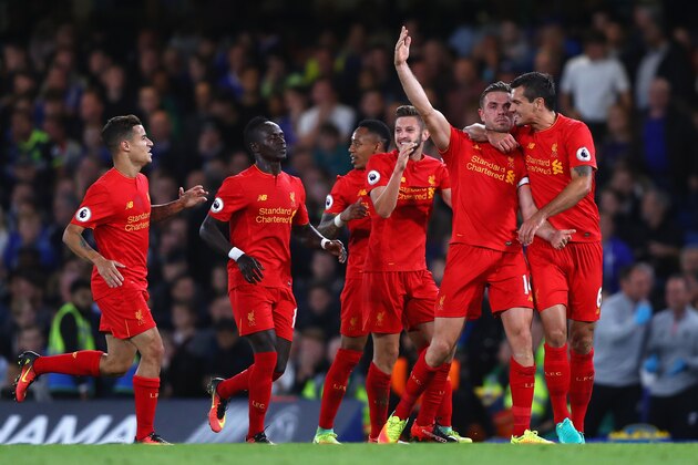 LONDON, ENGLAND - SEPTEMBER 16:  Jordan Henderson of Liverpool celebrates scoring his sides second goal with team mates during the Premier League match between Chelsea and Liverpool at Stamford Bridge on September 16, 2016 in London, England.  (Photo by Clive Rose/Getty Images)