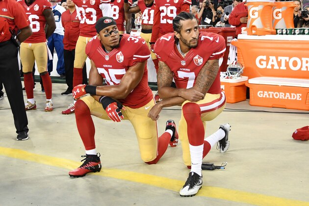 SANTA CLARA, CA - SEPTEMBER 12:  Colin Kaepernick #7 and Eric Reid #35 of the San Francisco 49ers kneel in protest during the national anthem prior to playing the Los Angeles Rams in their NFL game at Levi's Stadium on September 12, 2016 in Santa Clara, California.  (Photo by Thearon W. Henderson/Getty Images)