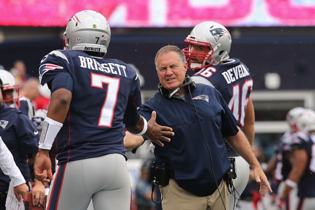 FOXBORO, MA - SEPTEMBER 18:  Head coach Bill Belichick of the New England Patriots high fives Jacoby Brissett