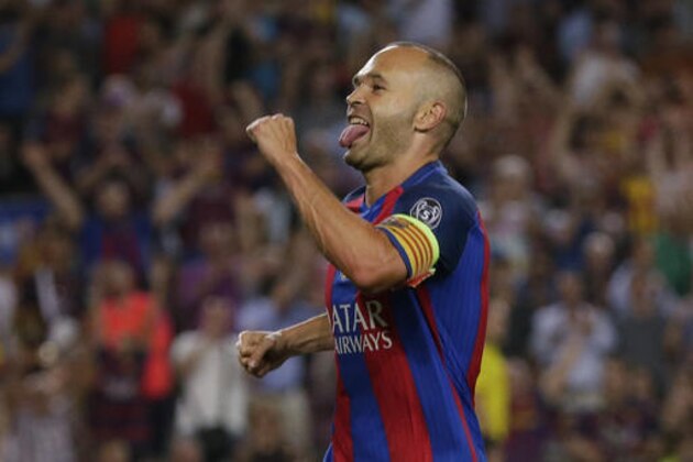 Barcelona's Andres Iniesta celebrates scoring his side's 4th goal during a Champions League, Group C soccer match between Barcelona and Celtic, at the Camp Nou stadium in Barcelona, Spain, Tuesday, Sept. 13, 2016. (AP Photo/Emilio Morenatti)